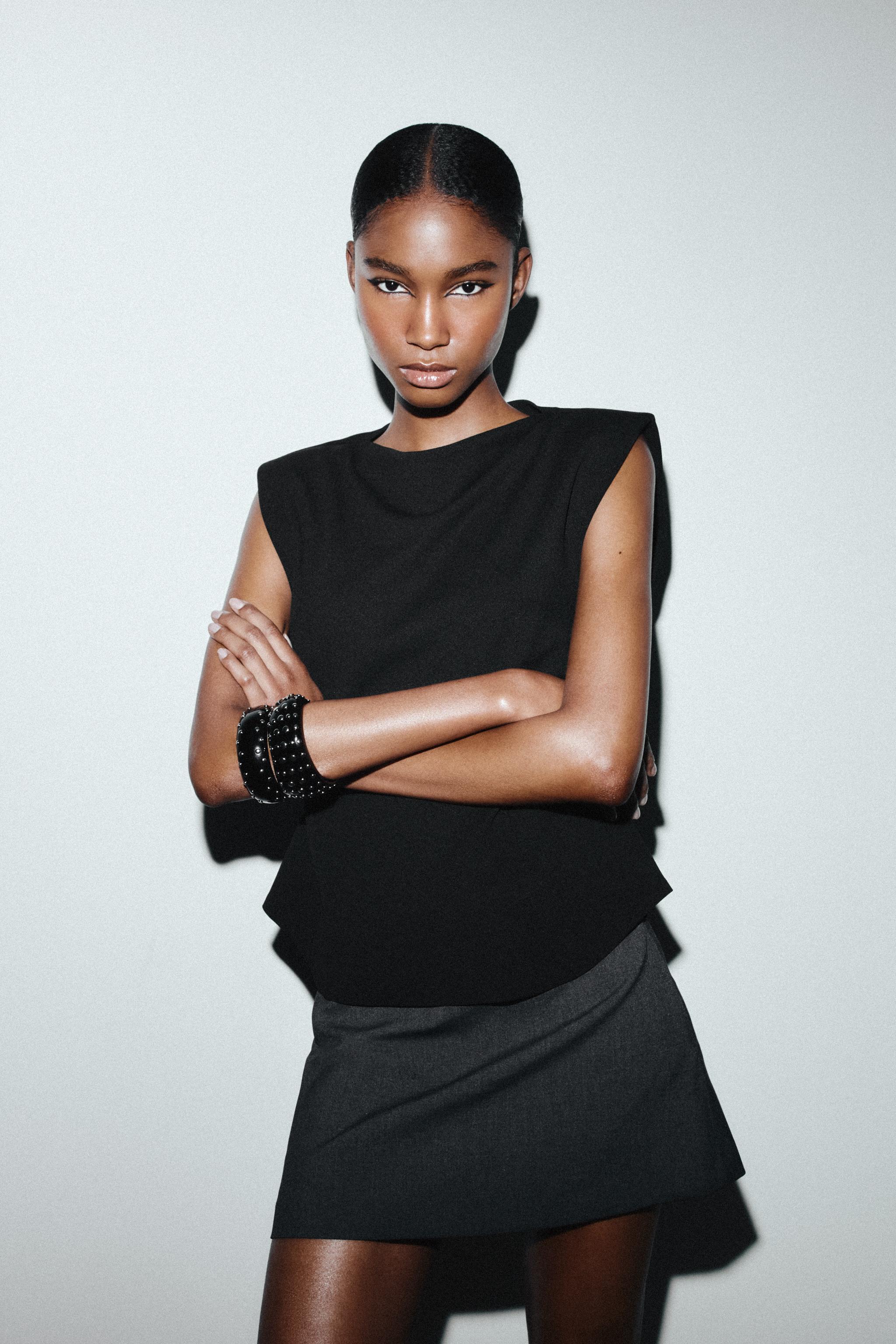 CREPE PEPLUM SHOULDER PAD TOP